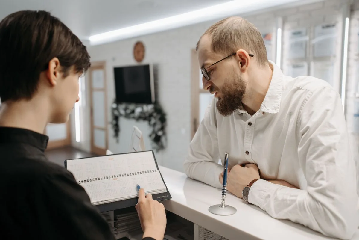 Appointment booking chatbot on a smartphone with calendar scheduling